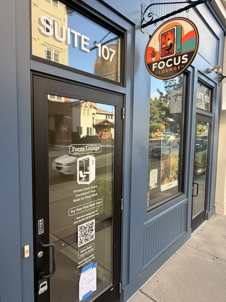 Focus Lounge storefront and hanging sign in Downtown Storrs